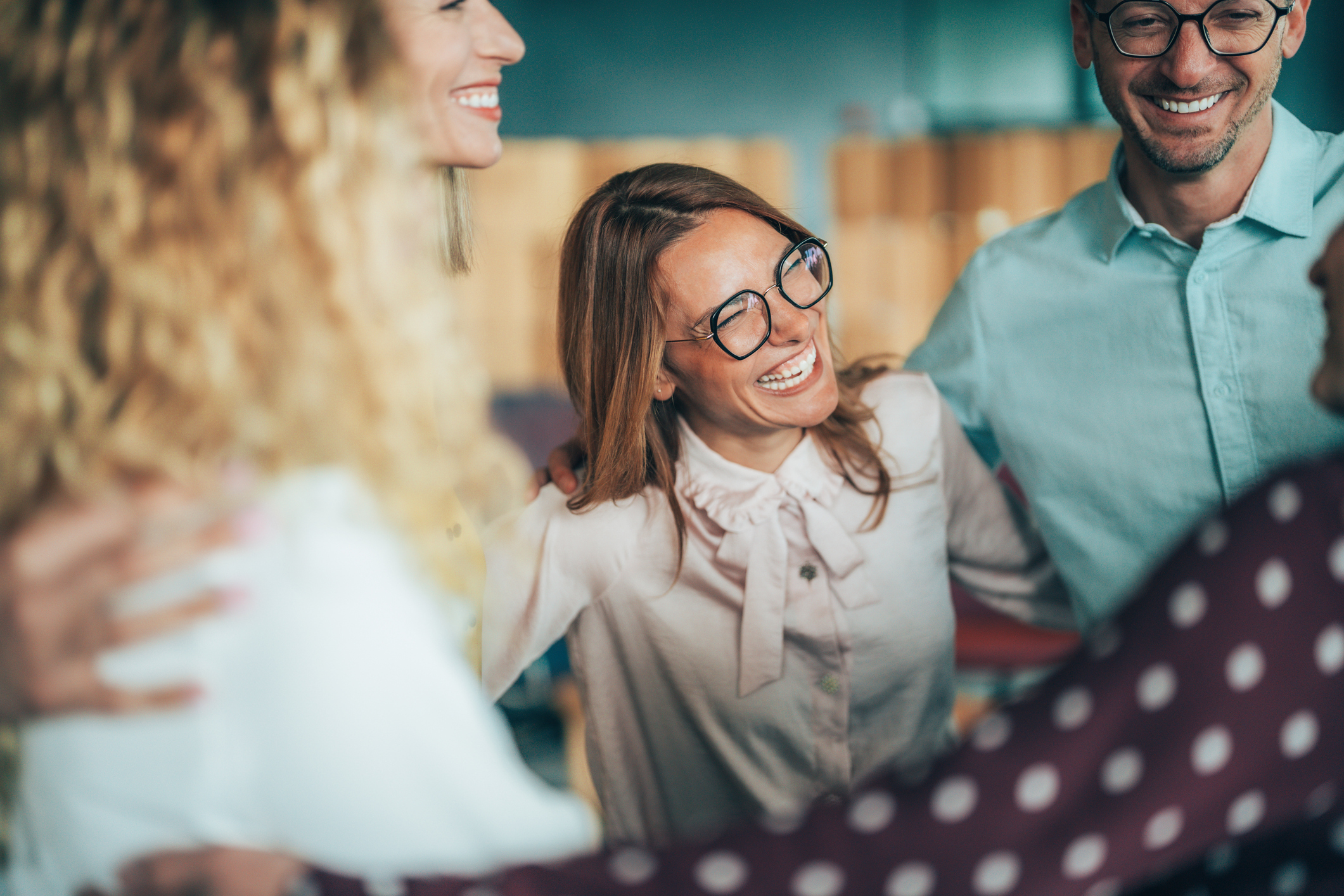 Cheerful team huddle in the office