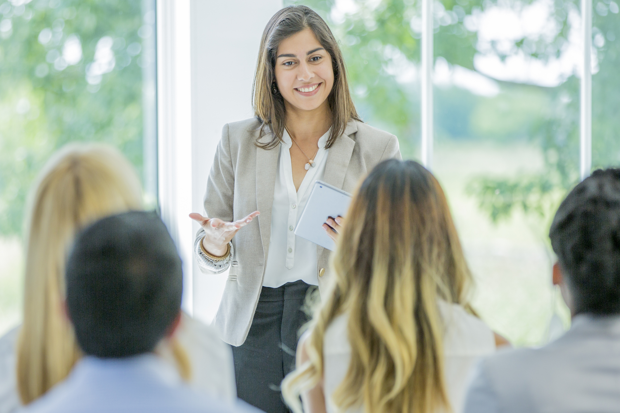 Mixed Race Woman Giving Business Presentation stock photo