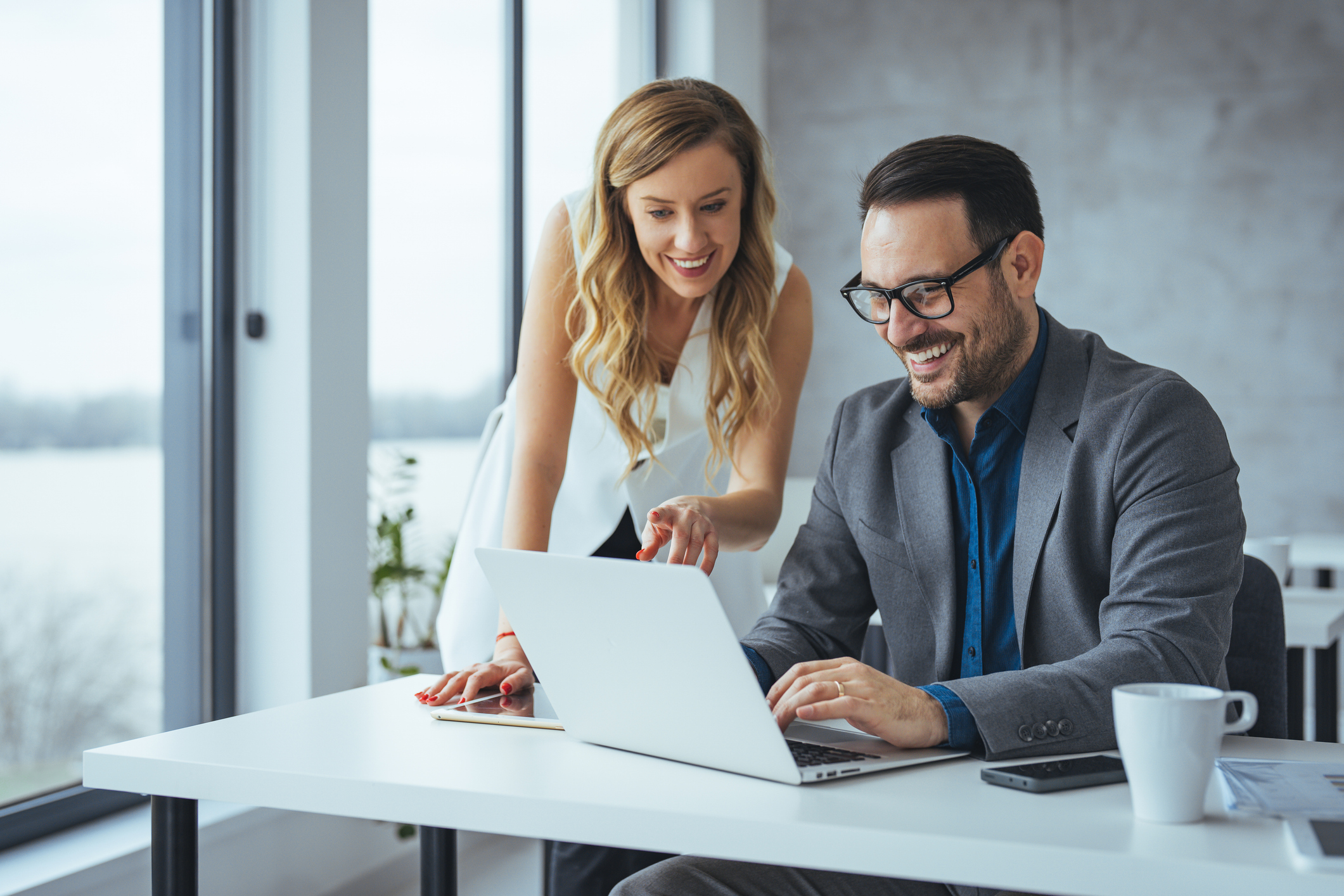 Colleagues Collaborating Happily in a Modern Office Setting